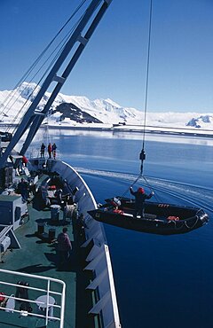 ANTARCTICA  Transport Lowering Zodiac inflatable boats from a ship for taking passengers ashore