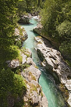 SLOVENIA  Trenta Valley Soca River Viewed from Felika Korita Soce a narrow wooden suspension bridge  flowing through rocks shaped by the power of the water   Clear blue water narrow gorge limestone rocks clean water important river