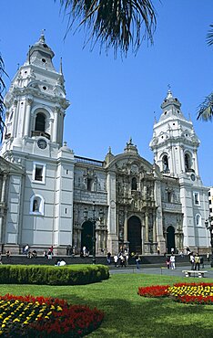 PERU  Lima Cathedral  Plaza de Armas   Plaza Mayor .   Travel Tourism Holiday Vacation Explore Recreation Leisure Sightseeing Tourist Attraction Tour Destination Plaza De Armas Mayor Lima Peru Peruvian South America Blue Sky Tranquility Tranquil Vivid Vibrant City Capital Tradition Traditional Culture Cultural Building Architecture Architectural Cathedral Church Churches Religion Religious Pray Prayer Worship Worshipping Worshiping Christianity Holy Divine Christian Theology Faith Sacred Devout Catholic Catholicism Magnificent Impressive Majestic Faade Edifice Bell Tower Spire Steeple Landmark Ethnic Dominant Dominating Prominent Lawn Flower Bed People Visitors Entrance Converge Converging Convergent Grass UNESCO World Heritage Site Calendar American South America