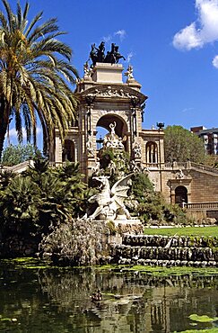 SPAIN Catalonia Barcelona Parc de la Ciutadella  Font Monumental. Travel Tourism Holiday Vacation Explore Recreation Leisure Sightseeing Tourist Attraction Tour Font Monumental Parc de la Ciutadella Barcelona Spain Spanish Europe European Union EU Catalonia Catalunya Catalan Tranquility Tranquil Peaceful Building Architecture Architectural Historic Historical Ornate Monument Carved Stonemasonry City Landmark Statue Impressive Dominant Dominating Prominent Fountain Calm Water Summer Bright Sunny Sun Blue Sky Ornamental Huge Large Neoclassical Tall Vertical Antoni Gaudi Imposing Park Parkland Spectacular Vivid Vibrant Sculpture Reflect Reflection Palm Tree Dragon Vacation Barna Espainia Espana Espanha Espanya European Union Hispanic History Reflexion Southern Europe