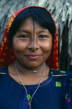 PANAMA San Blas Islands Ustupu Kuna Indians Portrait of smiling Kuna woman with gold nose ring and black line drawn along length of nose thought to enhance beauty. Cuna Caribbean American Central America Female Women Girl Lady Hispanic Latin America Latino Panamanian West Indies