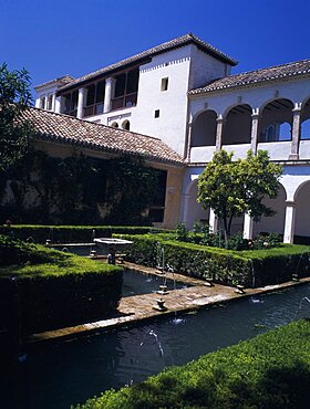 The Alhambra, Generalife Gardens, Jardin de Sultana with fountains and Generalife Palace or Summer Palace, Granada, Andalucia, Spain