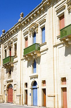 The waterfront redevelopment of old Baroque Pinto wharehouses below the bastion walls of Floriana beside the cruise ship terminal, Valletta, Malta