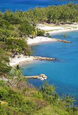 Pigeon Island National Historic Park Small crescent shaped beaches and a wooden jetty set amongst coconut palms and casuarina trees, Gros Islet, St Lucia