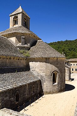 Exterior view of chapel and courtyard of twelth century Cistercian monastery, known as one of the Three Sisters of Provence, Abbaye Notre Dame de Senanque, Provence, France, Europe