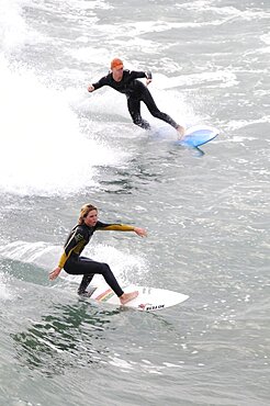 Riding the surf at Huntington Beach, United States of America