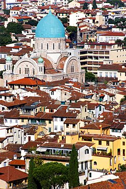 ITALY, Tuscany, Florence, The green copper dome of the 19th Century Tempio Maggiore, the Great Synagogue of Florence and city rooftops