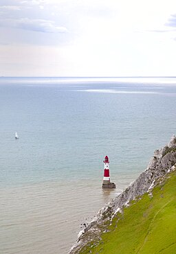 England, East Sussex, Eastbourne, Beachy Head, view of the lighthouse at the base of the chalk cliffs