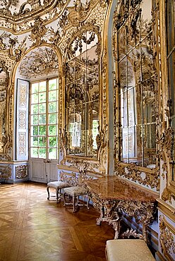 Germany, Bavaria, Munich, Nymphenburg Palace. Amalienburg The Hall of Mirrors. Hunting lodge created for Electress Amalia in European Rococo style. Highly ornate white and gold interior with mirrored walls.