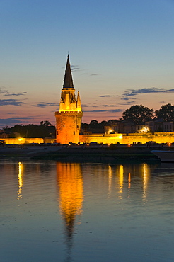 Old prison tower seen across the harbour entrance at dusk, La Rochelle, Charente-Maritime, France, Europe