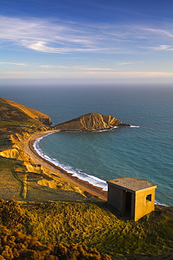 The high cliff tops of Flowers Barrow provide far reaching views for lookouts inside this Second World War pillbox, Worbarrow Bay, Jurassic Coast, UNESCO World Heritage Site, Dorset, England, United Kingdom, Europe