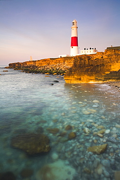 Early morning sunshine lights up Portland Bill lighthouse, Portland, Jurassic Coast, UNESCO World Heritage Site, Dorset, England, United Kingdom, Europe