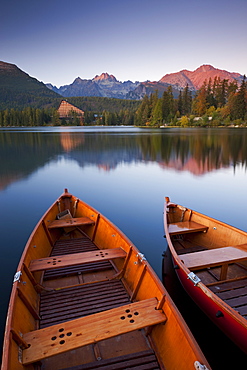 Wooden boats on Strbske Pleso lake in the Tatra Mountains, Slovakia, Europe