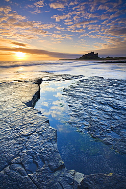 Bamburgh Castle and coastal landscape at sunrise, Bamburgh, Northumberland, England, United Kingdom, Europe