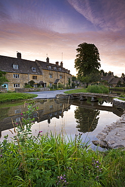 Cottages in the picturesque Cotswolds village of Lower Slaughter at sunrise, Gloucestershire, The Cotswolds, England, United Kingdom, Europe