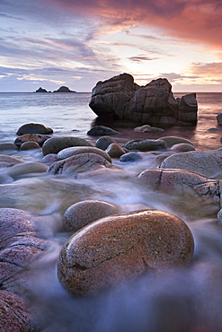 Porth Nanven cove and the Brisons Islands at sunset, Cornwall, England, United Kingdom, Europe