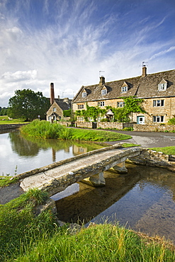 Stone footbridge and cottages at Lower Slaughter in the Cotswolds, Gloucestershire, England, United Kingdom, Europe 