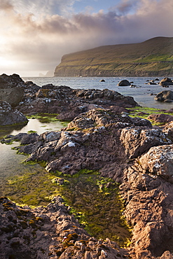 Rockpools on the foreshore on the west coast of Sandoy, Faroe Islands, Denmark, Europe 