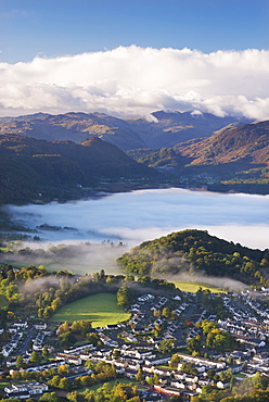 Aerial view over Keswick to a mist covered Derwent Water, Lake District National Park, Cumbria, England, United Kingdom, Europe 