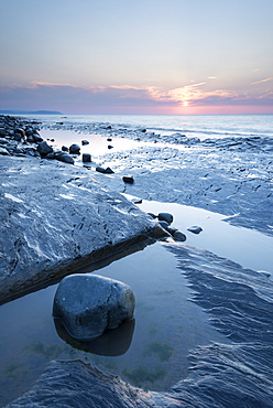 Sunset over the rocky shores of Kilve Beach, Somerset, England, United Kingdom, Europe 