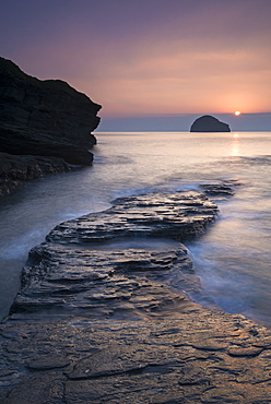 Sunset over Gull Rock from Trebarwith Strand, Cornwall, England, United Kingdom, Europe