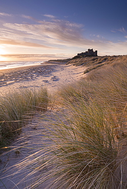 Sunrise over Bamburgh Castle, Northumberland, England, United Kingdom, Europe