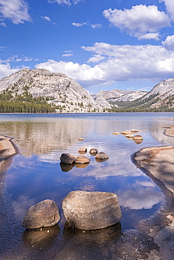 Granite domes of Yosemite reflected in the calm waters of Tenaya Lake, Yosemite National Park, UNESCO World Heritage Site, California, United States of America, North America