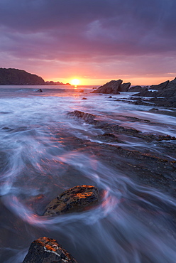 Beautiful sunset over the dramatic rocky seashore of Combe Martin on the Exmoor coast, North Devon, England, United Kingdom, Europe