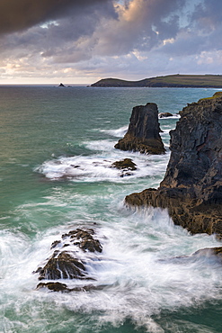 Waves crash over rock stacks near Treyarnon on the north coast of Cornwall, England, United Kingdom, Europe