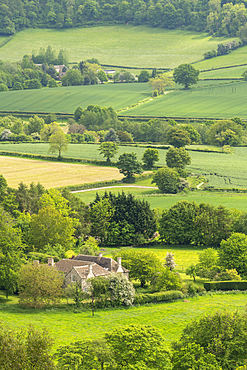 Farmhouse surrounded by rolling Cotswolds countryside, Dursley, Gloucestershire, England, United Kingdom, Europe