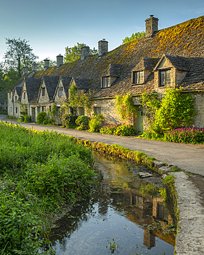 Arlington Row cottages in the pretty Cotswold village of Bibury, Gloucestershire, England, United Kingdom, Europe