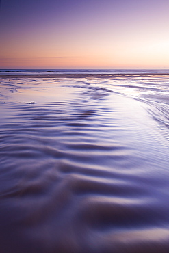 Rippled water running over the beach at Constantine Bay, Cornwall, England, United Kingdom, Europe