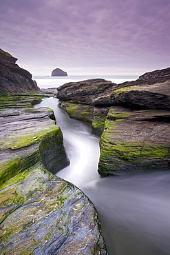 Narrow channel with stream passing through slate ledges to Trebarwith Strand beach, Cornwall, England, United Kingdom, Europe