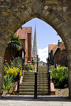 St. Michael's Church and modern housing developments seen through a medieval wall arch in walls, Southampton, Hampshire, England, United Kingdom, Europe