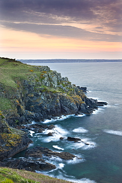 Sunrise above the headland at Hot Point on the Lizard Peninsula, Cornwall, England, United Kingdom, Europe