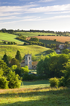 Naunton church nestled in the beautiful rolling Cotswolds countryside, Gloucestershire, England, United Kingdom, Europe