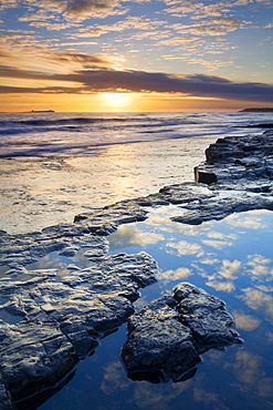 Sunrise over Bamburgh Beach in winter, Northumberland, England, United Kingdom, Europe