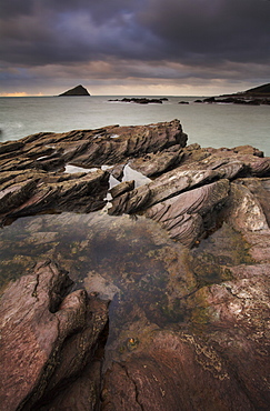 A moody evening at Wembury Bay, looking towards the Great Mewstone on the horizon, Wembury Bay, Devon, England, United Kingdom, Europe