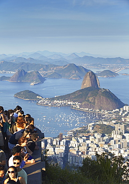 Tourists enjoying view of Sugar Loaf Mountain (Pao de Acucar) and Botafogo Bay from Corvocado, Rio de Janeiro, Brazil, South America