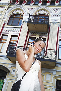 Woman on cell phone in Ivana Franka Square, Kiev, Ukraine, Europe