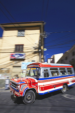 Bus passing along street, La Paz, Bolivia, South America