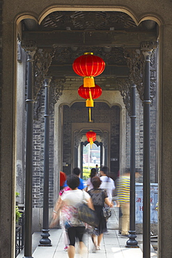 People walking along corridor at Chen Clan Academy, Guangzhou, Guangdong, China, Asia