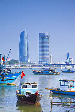 Fishing boats on Song River and city skyline, Da Nang, Vietnam, Indochina, Southeast Asia, Asia