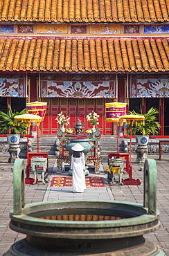 Woman wearing Ao Dai dress at Mieu Temple inside Citadel, Hue, Thua Thien-Hue, Vietnam, Indochina, Southeast Asia, Asia