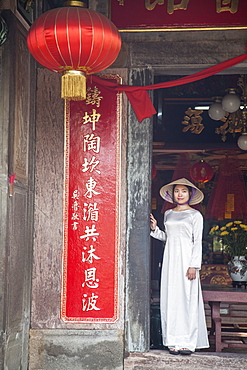 Woman wearing Ao Dai dress at Phouc Kien Assembly Hall, Hoi An, UNESCO World Heritage Site, Quang Nam, Vietnam, Indochina, Southeast Asia, Asia