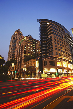 Light trails of traffic passing Da Vinci Hotel, Sandton, Johannesburg, Gauteng, South Africa, Africa