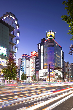 Ferris wheel and shopping street at dusk, Nagoya, Honshu, Japan, Asia