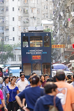 Tram passing along Chun Yeung Street market, North Point, Hong Kong Island, Hong Kong, China, Asia