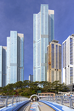 Footbridge and skyscrapers at Songdo beach, Busan, South Korea, Asia