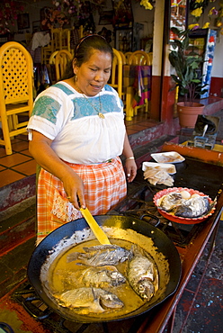 Local woman cooking fish, Isla Janitzio, Lago de la Patzcuaro, Patzcuaro, Michoacan, Mexico, North America